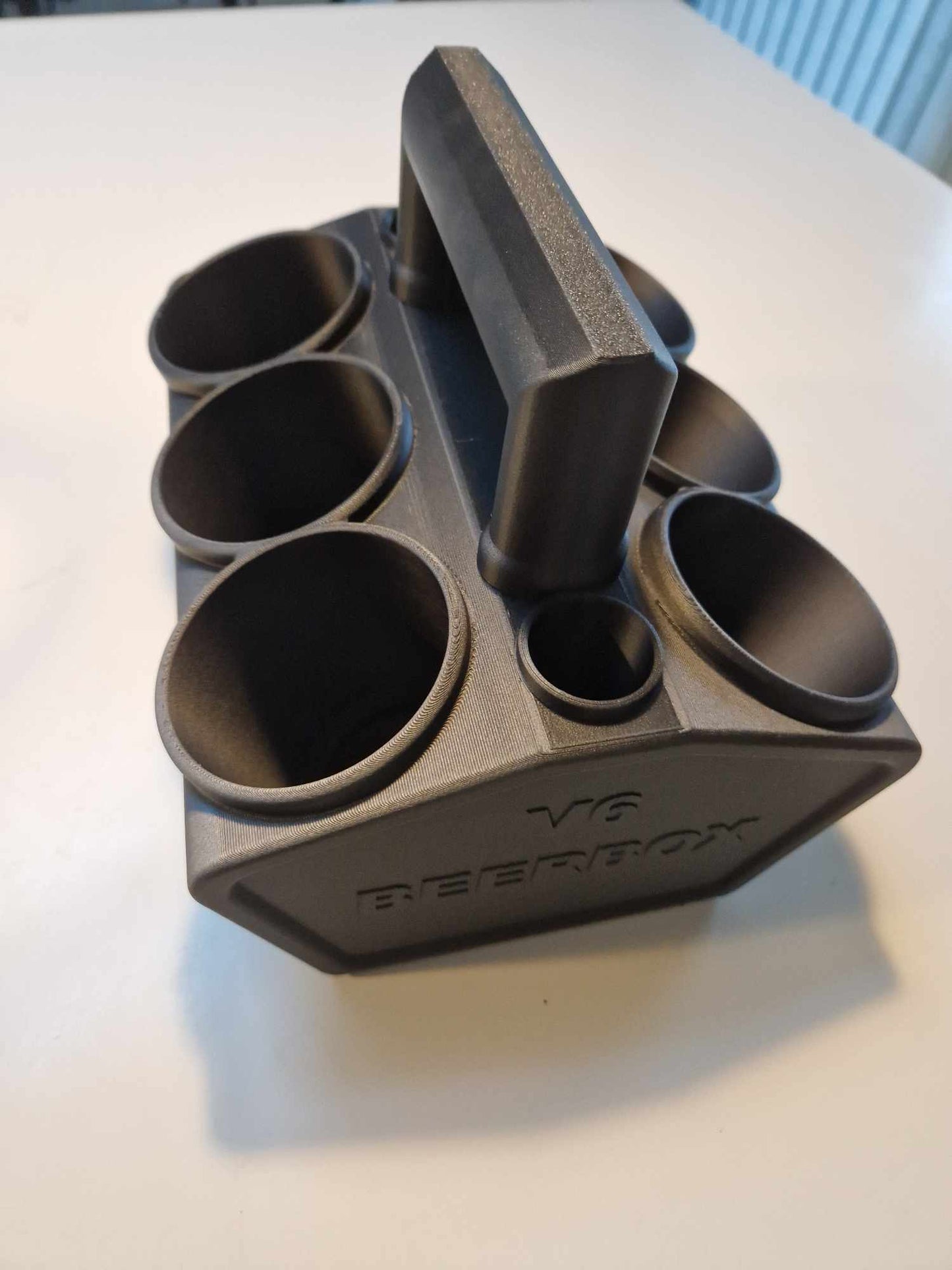 Engine block holder for 6 cans